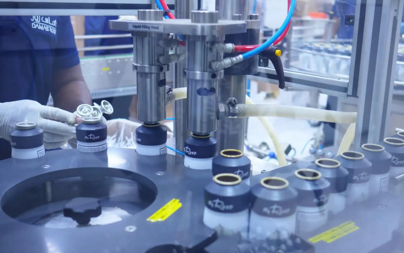 Perfume bottles on an automated filling machine