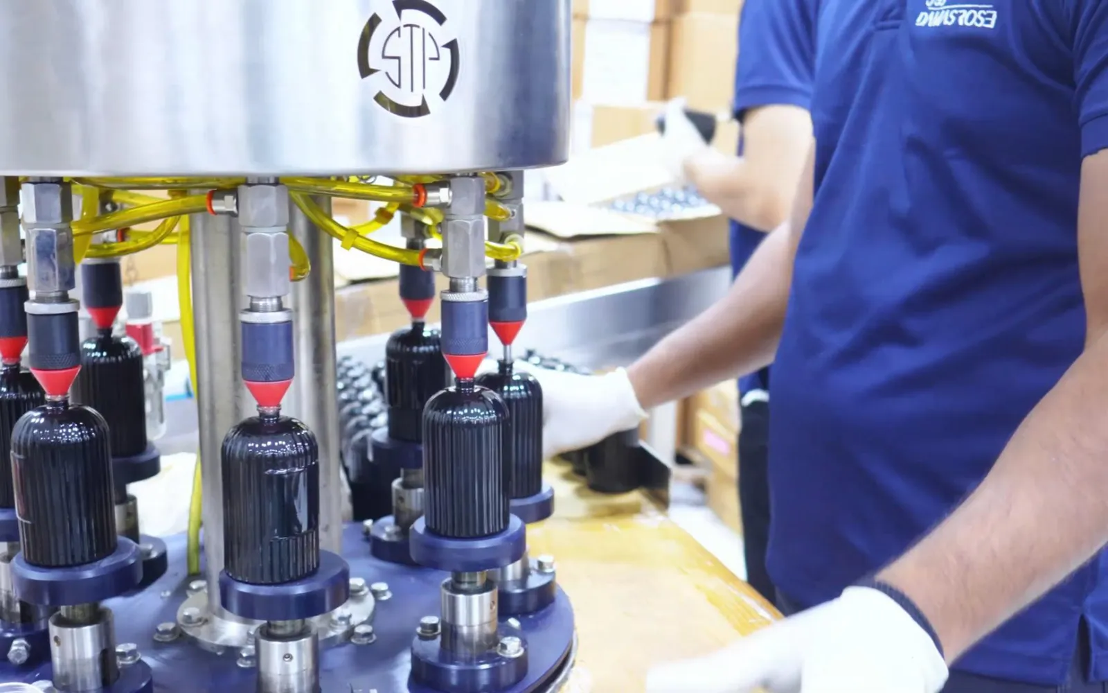 Gloved operator at the capping line